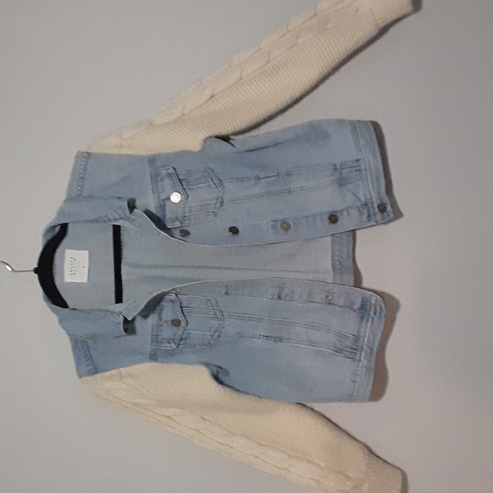 Denim jacket with crocheted sleeves
